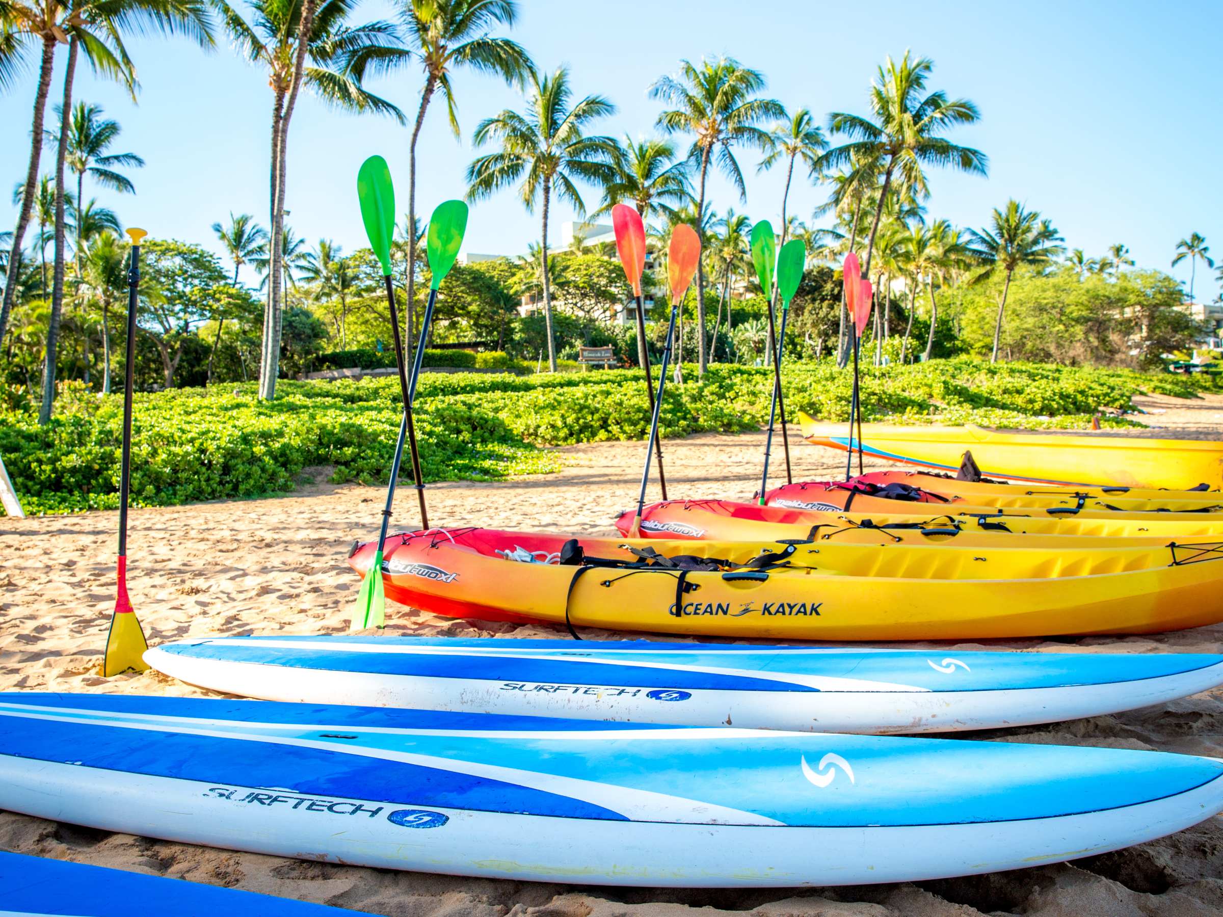 a boat sitting on top of a sandy beach